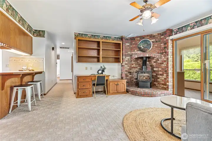 From family room, looking down hall leads back to owner's suite & 2nd bdrm upstairs. Kitchen on left