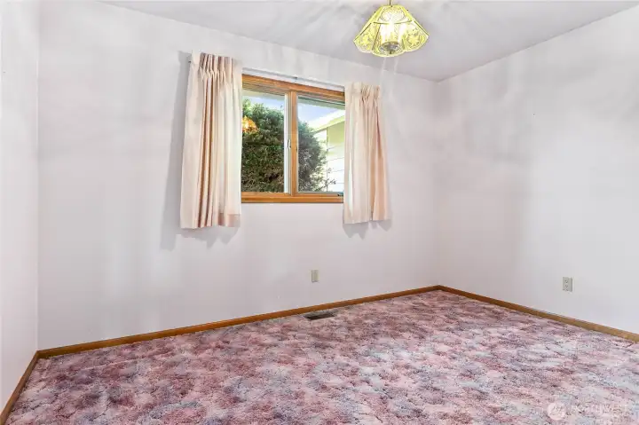 2nd upstairs bedroom looking out to backyard