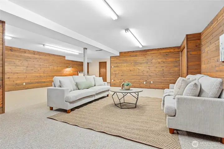 Looking back toward where stairs come down, closed door is for large cellar storage w/shelving