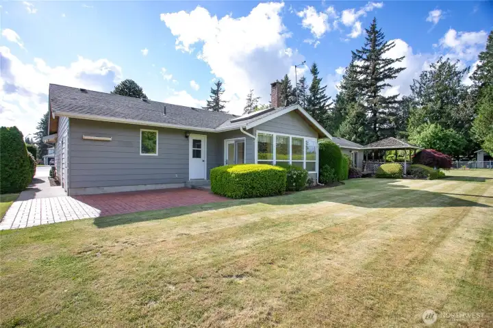 Sunroom windows with access. There is another door from sidewalk on left side here that enters right where basement stairwell is.