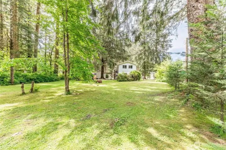 Private, wooded setting on two lots. Evergreen trees and a park-like lawn give this property the seclusion you came here for.