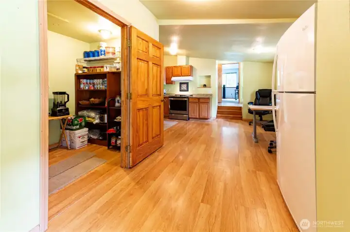View from living room toward the kitchen and bonus room beyond. The open flow of this floor plan works well for recreational living.