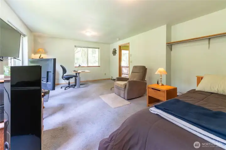 Bonus room showing the deck access door and open layout. This is the kind of flexible space a recreational property needs!