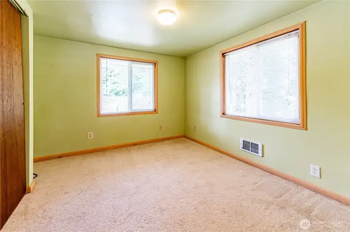 Bedroom two also has dual windows, and a quiet wooded outlook.