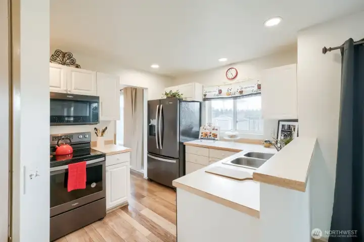 Newer Stainless appliances & smooth top stove.