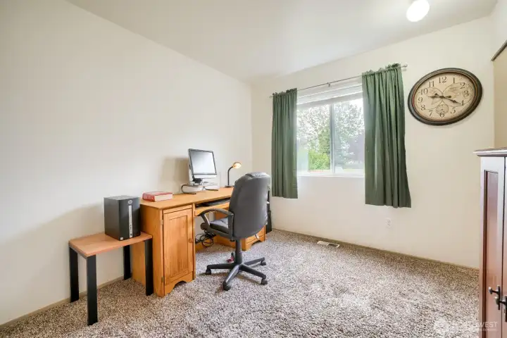 Partial view of main floor bedroom being used as office. Great for the household member who doesn't do stairs.