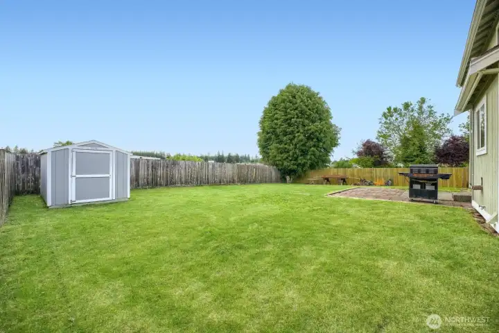 Handy storage shed in addition to garage storage.