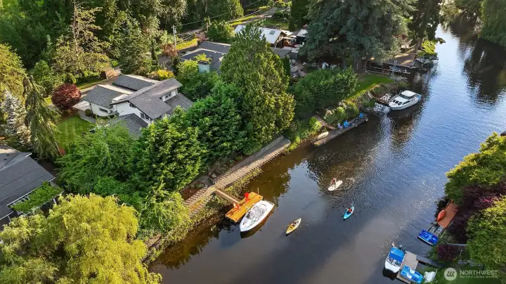 90' of Waterfront Sammamish River in Kenmore. A once every generational opportunity to own a waterfront home with access to Lake Washington, Lake Union and beyond!