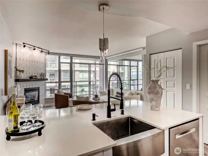 Where the kitchen opens to sweeping city windows and the evening just unfolds.