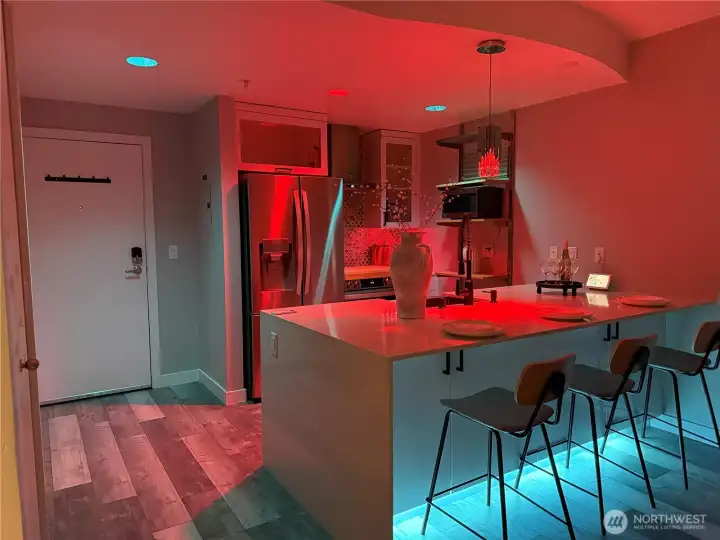 Voice-controlled lighting allows customizable color ambiance, including team-inspired tones for game nights and beyond.