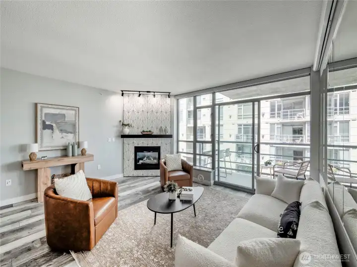 Settle into sweeping water views, a glowing fireplace, and light that pours in all day.