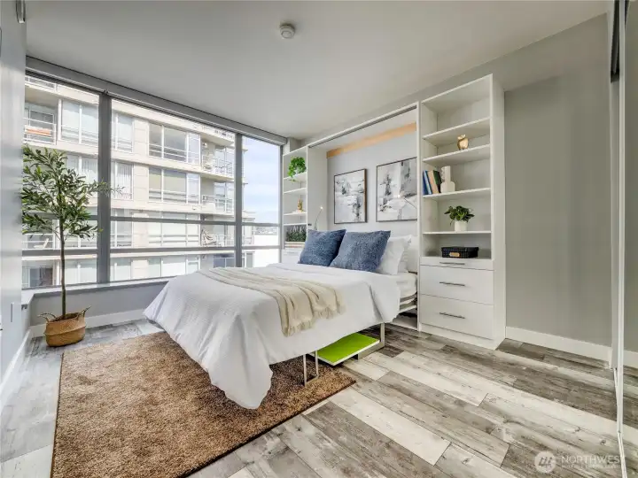 Wake to skyline views from a bedroom that doubles your space and your possibilities.