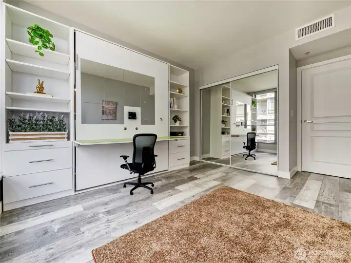 Custom built-ins and mirrored closets turn flexible living into a design statement.