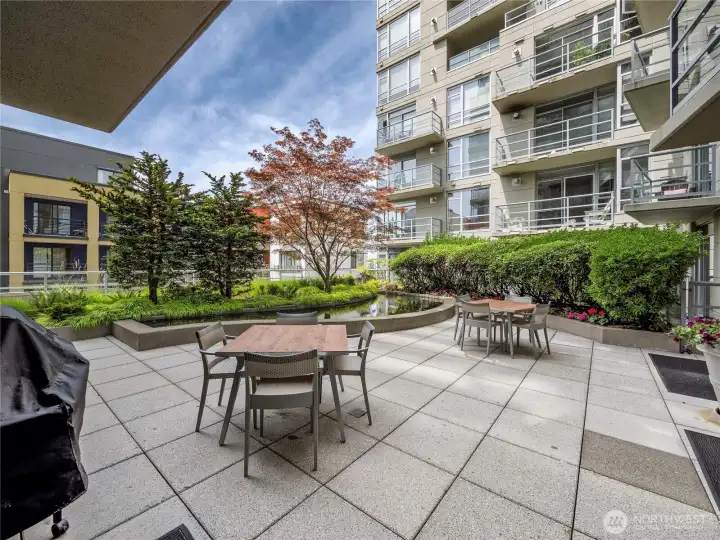 Grill, gather, and unwind in a landscaped oasis tucked within the heart of the building.