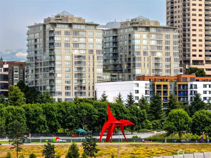 Nestled in the heart of the city, this residence offers an intimate connection to the lush greenery of the sculpture park below.