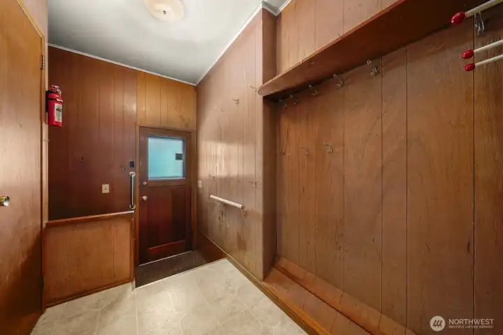 Mudroom, door leads to the back of the house and newer detached garage Mudroom, door leads to the back of the house and newer detached garage