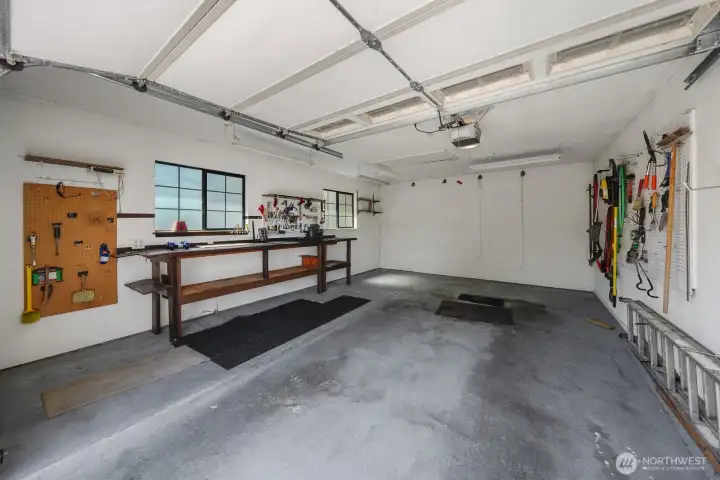 Detached garage with work bench. Alley access and 2 off street parking stalls. Detached garage with work bench. Alley access and 2 off street parking stalls.