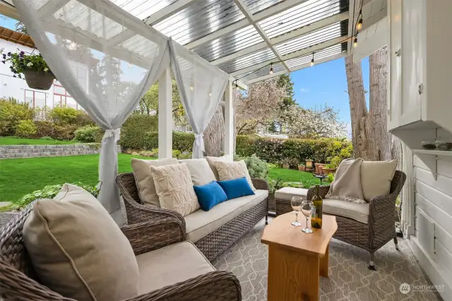 Relax on the back patio among the mature landscaping and fully fenced yard.