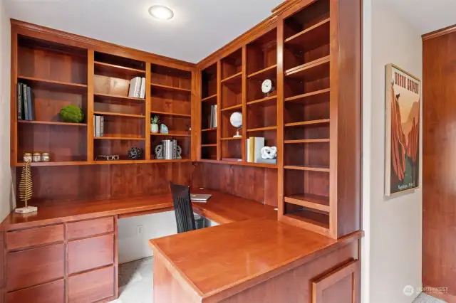 Second built-in office desk and cabinets.
