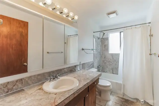 Spacious upper level full guest bathroom, perfect for accommodating your guests.