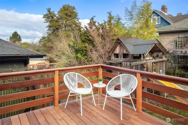 Gorgeous large cumaru deck overlooks a very functional and beautiful yard! Play structure includes a swing, slide and playhouse! The arbor in the corner of the yard provides covered eating area and bbq space year round.