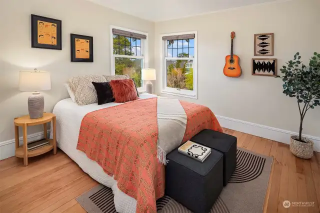 Hard to decide which of these upstairs rooms is the "best"! Beautiful. Classic. Airy. Home! This room has a partial view of the Cascades and Mt Baker!