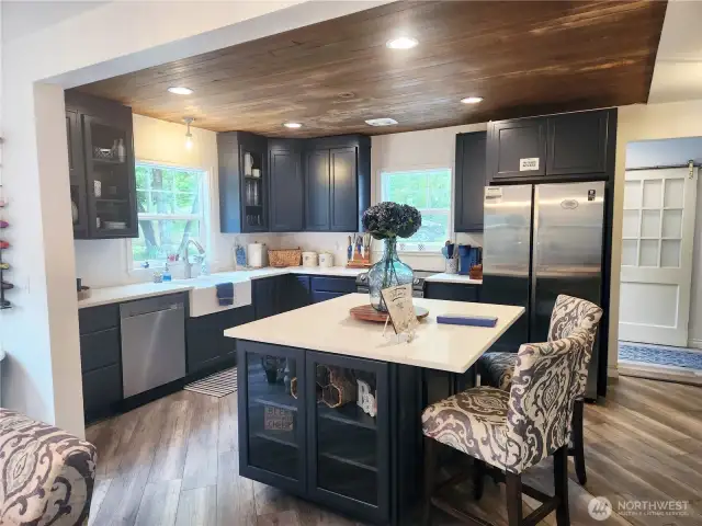 Another angle of the kitchen with recessed lighting.