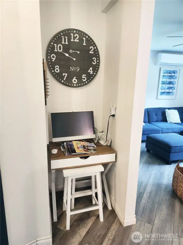Little nook used as a computer space just off the kitchen.  To the left of this space is the primary bedroom.