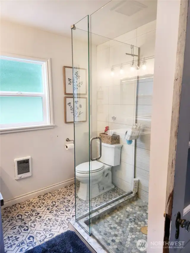 Shower is spacious and tiled beautifully.