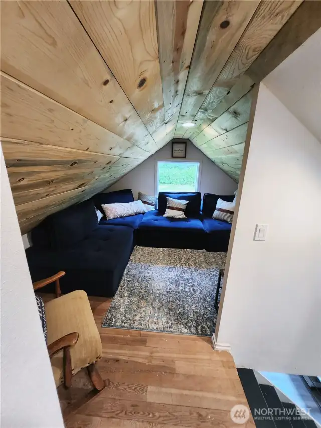 At the top of the stairs to the right is a spacious media area that can also be used as an area for guests to sleep.