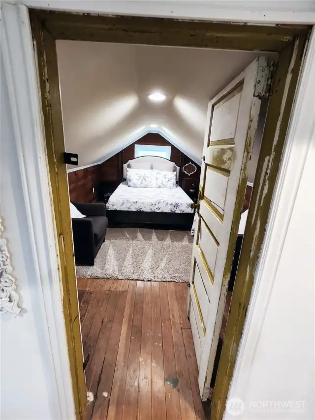 Off to the right of the seating area is the second bedroom.