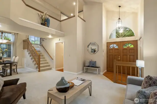 Living room & dining room with tall ceilings