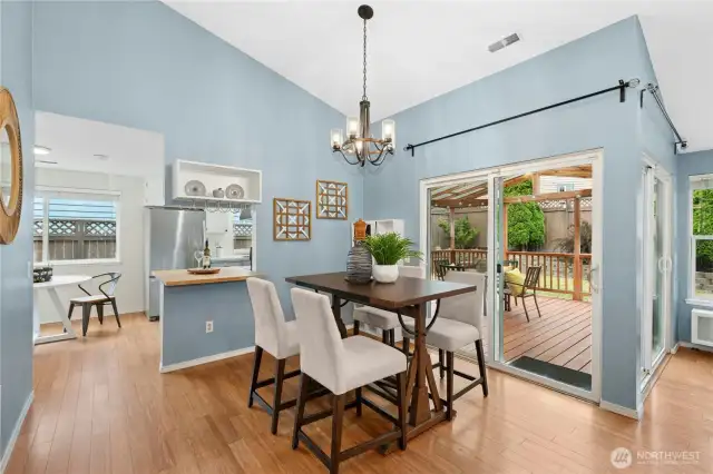 The dining room is open to the kitchen with easy access to the covered deck.