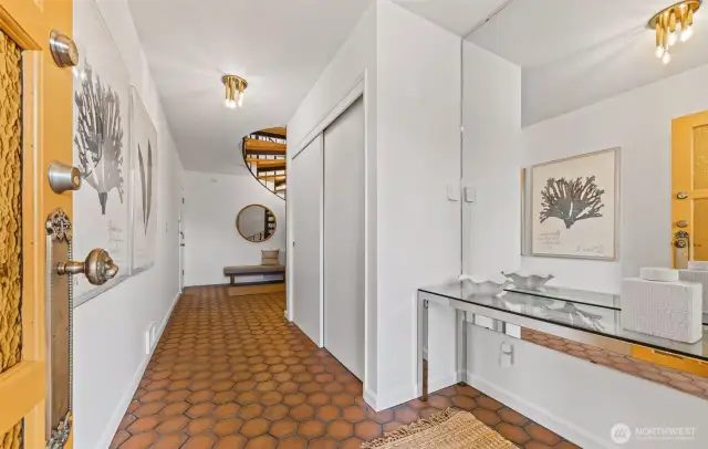 Entryway on lower level. Entrance from driveway directly to main floor, so you don't have to use the spiral staircase