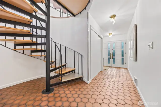 Entryway on lower level. Entrance from driveway directly to main floor, so you don't have to use the spiral staircase