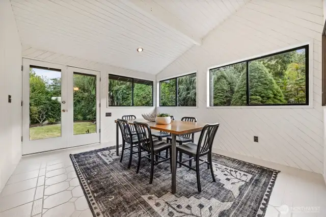 Sunroom with entryway door from driveway