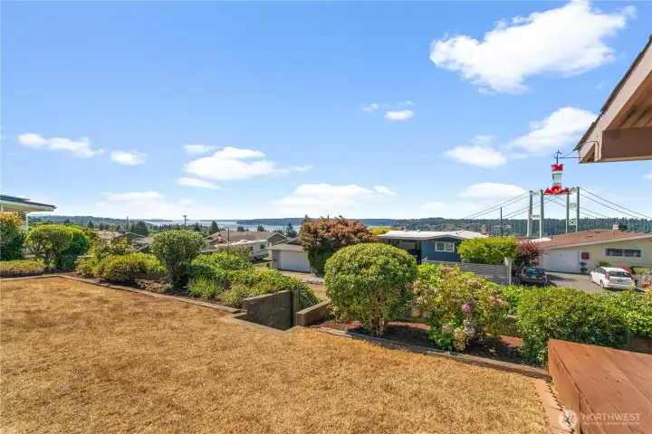 Spacious view parcel with a charming home offers endless potential.