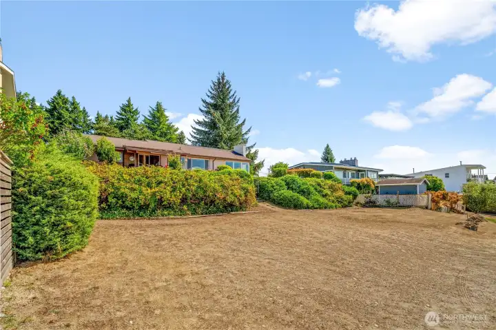 Spacious view parcel with a charming home offers endless potential.