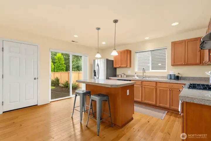 Garage entry into kitchen, and slider opens to the back yard.