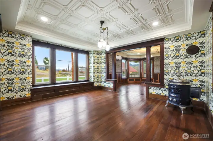 Dining room.  The parlor stove can stay with house at your request.  If it does, owner will build a hearth for it for you and install it.