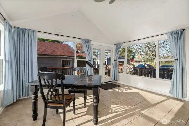 Sun Room- light and bright leading to outbuildings and back of property.
