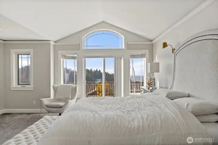 Primary bedroom with a balcony