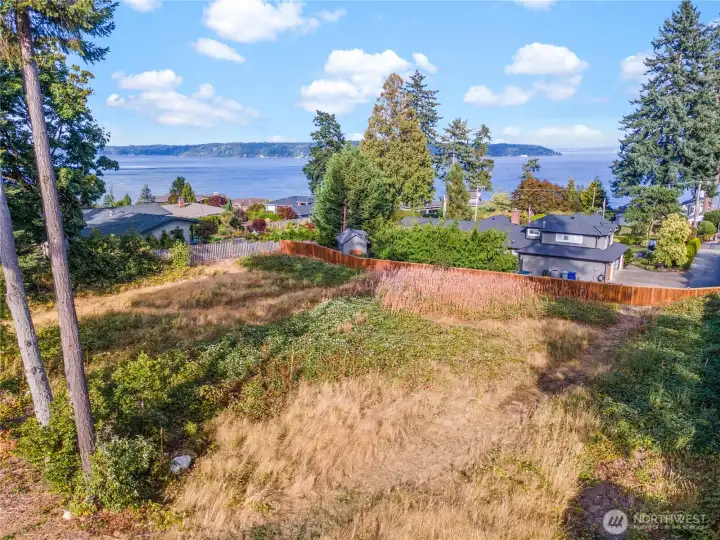 This view lot has sewer, water and gas available.  It is fenced on three sides and can be as private as you'd like.  Here's your opportunity to secure a Gig Harbor lot for your future dreams.