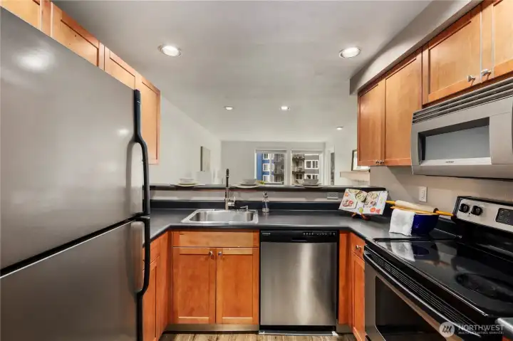 SS kitchen appliances and lots of counter space
