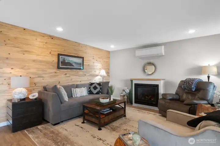 Gas Fireplace for the Winter and Ductless Mini-Split for the Summer in the Great Room with Custom Wood accent wall.