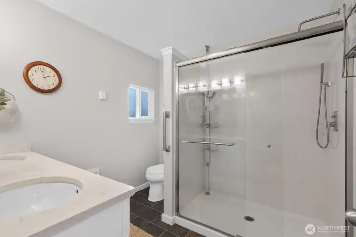 Custom walk-in shower and spacious bathroom off the Primary