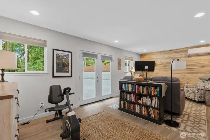 Large Family Room at the back of the house with custom wood feature wall.