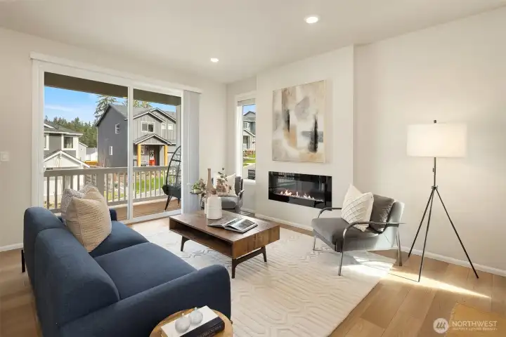 Living room walks out to deck that spans the length of the home - delightful indoor/outdoor living.