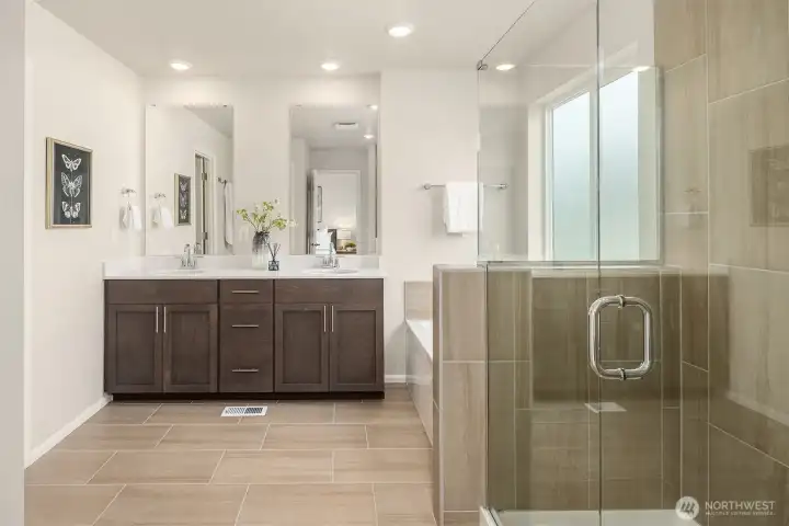 5 piece spa like bathroom off primary bedroom. Opens to walk-in closet and has shower and soaking tub.