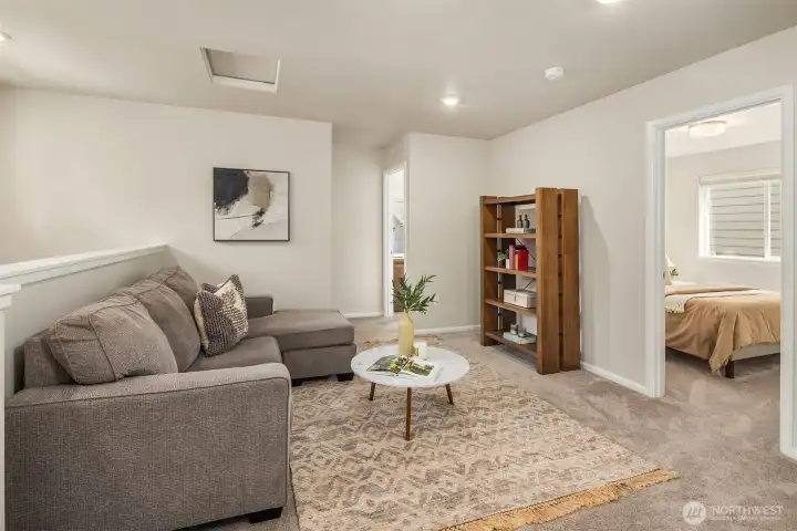 Upper seating area outside the 3 bedrooms on the top level - cozy spot to curl up and read a book or watch a movie.